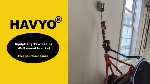 Tow Behind Wall Mount Bracket Kit For Lawn Care Attachments Space Saving Garage Organizer installed on wall with equipment 