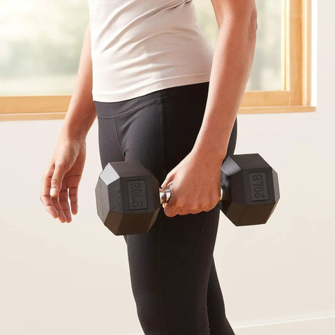 Person holding a 20 Pound Hex Dumbbell With Rubber Encased Cast Iron Core And Non Slip Contoured Handle For Home Gym Strength Training.
