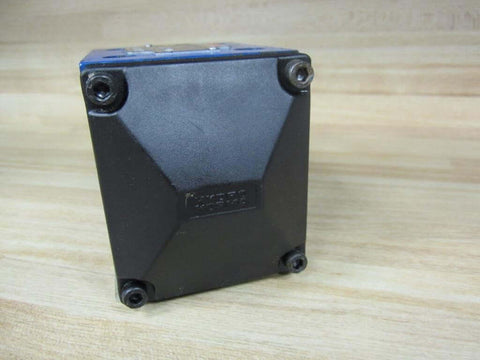 Side view of Bosch Rexroth R900590253 Hydraulic Valve with 4 screws on black base for industrial hydraulics