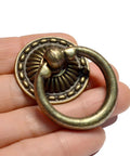 Close-up of 8-Piece Bronze Drawer Ring Pulls Set With Screws For Dresser Cabinet Wardrobe Chest Closet Vintage Decorative Hardware.