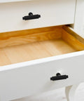 White dresser with 2 Pack Zinc Alloy Cabinet Handles For Drawers And Wardrobes, Metal Dresser Pulls in black, open drawer view.