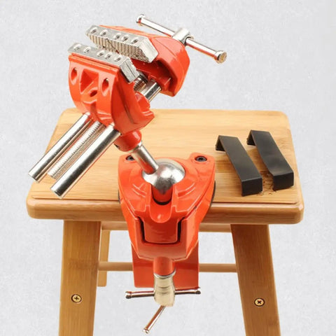 Shop Ready 3 Inch Heavy Duty Bench Vise With Rock Solid 360 Degree Ball Joint Tilt And Secure Clamp Mount For Garage Workshops Crafted From Durable Cast Steel Workshop Tools on a wooden surface.