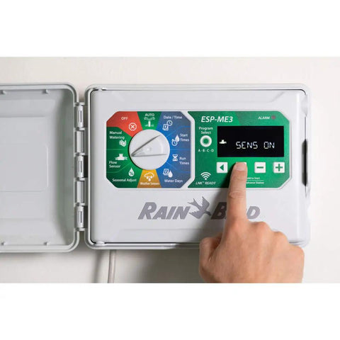 Person adjusting settings on Expandable ESPME3 Lawn Irrigation Controller for Indoor and Outdoor Use With 4 to 22 Stations