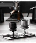 Three Piece Sleek Espresso Powder Receiver Cup And Dosing Funnel Fits 51 54 58Mm Portafilters showing black and silver dosing funnels.