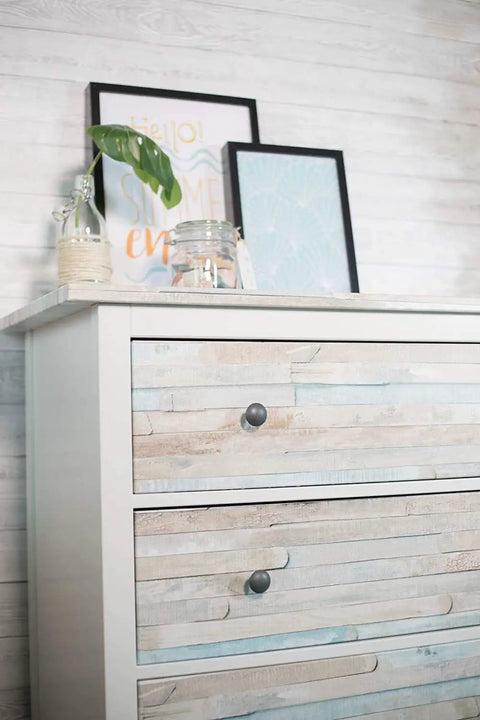 White dresser with Beechwood Self Adhesive Decorative Film Large 26x78 Inch Roll 2 Pack For Cabinets Furniture Walls And Shelves DIY Makeover Easy Peel And Stick Real Wood Grain Finish applied on drawers, picture frames on top