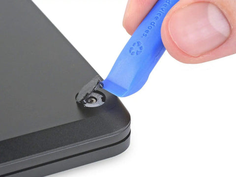 Using Essential Electronics Toolkit for DIY Home and Tech Repairs with Magnetic Bit Screwdriver 16 Precision Bits Opening laptop