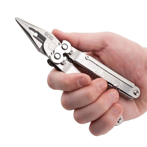 Person holding Powerlock Heavy Duty 18 Tool Multitool with pliers, stainless steel finish, showing pliers feature.