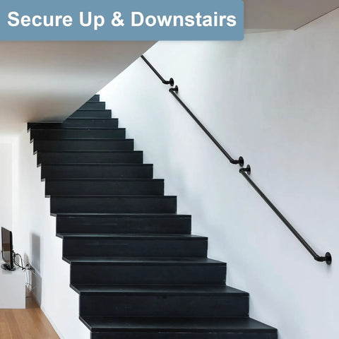Heavy Duty Black Powder Coated Pipe Stair Handrail Six Foot Wall Mounted Corner Railing for Indoor Steps, shown along dark stairs.