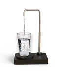 Portable Desktop Water Dispenser With Auto Pump And USB Rechargeable Water Bottle Pump dispensing water into a glass