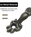 Close-up of vintage-style drawer pull in bronze finish, showing floral design and mounting screws, part of 24 Pcs set, zinc alloy.