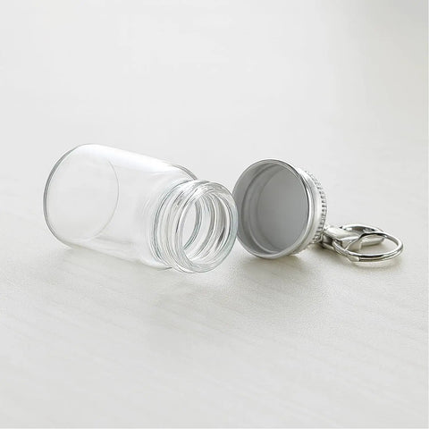 Top Tier 12 Pack 7 ml Mini Glass Bottle Keychains Featuring Secure Screw Lids And Heavy Duty Metal Rings, open with keychain.