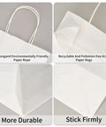 Close-up view of white kraft paper bags with strong handles and durable construction for sustainable use.