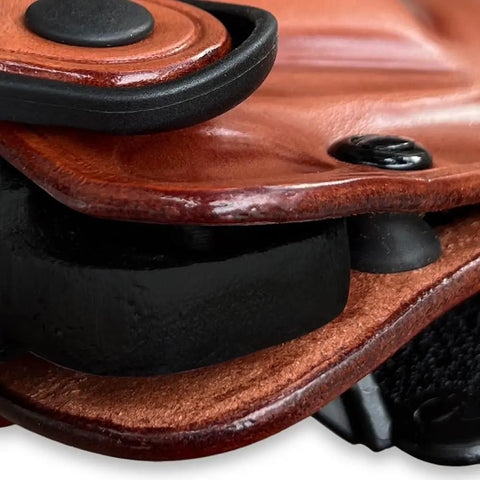 Close-up of OWB Leather Paddle Revolver Holster With Retention Strap For Pietta 1858 Ace Black Powder 44 Cal 3 Inch Right Hand