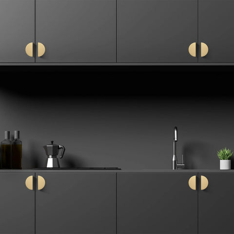 Solid Brass Cabinet Pulls 5 Pack Gold Half Moon Drawer Handles on black kitchen cabinets with brushed brass finish.