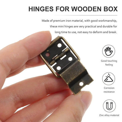 Hand holding Mini Jewelry Box Hinges With Screws 30 Pcs Metal Hardware For Small Wooden Boxes And Craft Projects, showing metal hinge.