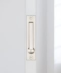 Pocket Door Edge Pull 4 Inch Hidden Flush Mount Handle for Pocket Sliding Doors Spring Loaded Self Retracting Lever in use