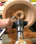 Carbide wood lathe detailer turning tool, unhandled, stainless steel, in use on spinning wooden bowl
