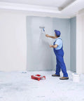 Person painting a wall with Temporary Floor Protection Roll 36 Inch By 100 Foot Anti Slip Surface Easy To Apply Paint Proof Reusable Durable Material