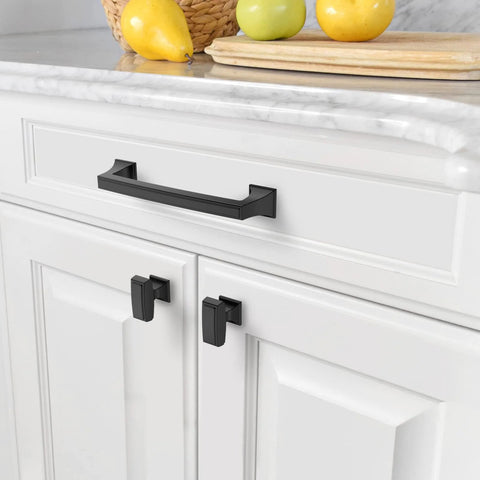Matte Black Cabinet Pulls 10 Pack 5 Inch Center To Center Hardware installed on a white kitchen cabinet drawer.