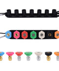 Front view of seven color-coded brass pressure washer nozzle tips with a black holder and 1/4-inch quick-connect