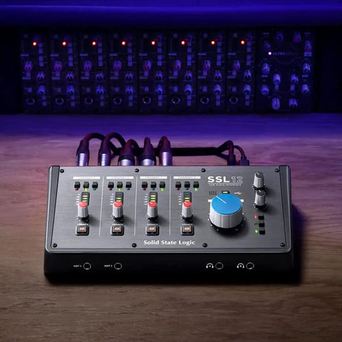 12 In 8 Out USB Audio Interface With Studio-Quality Sound, 192kHz 32-Bit Converters in a dark studio setting