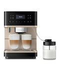 Top Shelf Fully Automatic Coffee And Espresso Maker Featuring Quiet Steel Grinder And Rich Milk Frother, brewing two lattes with milk pitcher.