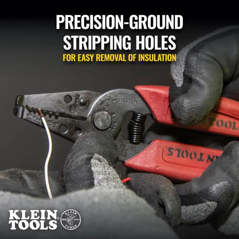 Close-up of Made In USA Compact Wire Stripper And Cutter For 16 To 26 AWG Stranded Wire in hand, showing precision-ground stripping holes.
