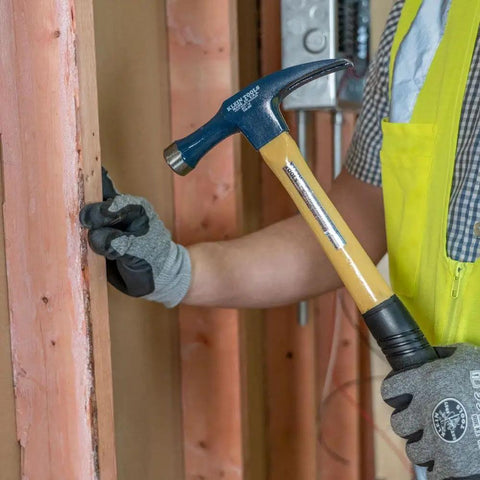 Electrician's Straight-Claw Hammer 18 Ounce Workhorse with Extra-Long Neck used by worker in construction setting