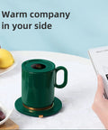 Smart Thermostatic Usb Coffee Mug Warmer Set To Keep Your Daily Brew Hot And Smooth Without Any Cold Cup Vibes Electric Heater Coaster For Home Office Desk with green mug on a table