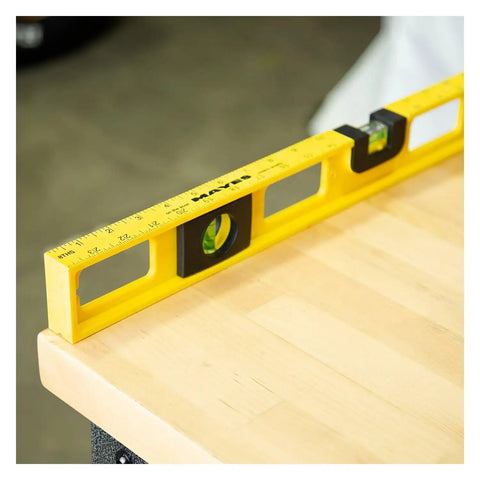 24 Inch Magnetic Top View Level Made In Usa featuring precision vials on a wooden surface, displaying ruler marks.