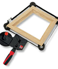 23 Ft Variable Angle Strap Clamp Kit With Four Pivoting Vario Clips around a wooden frame