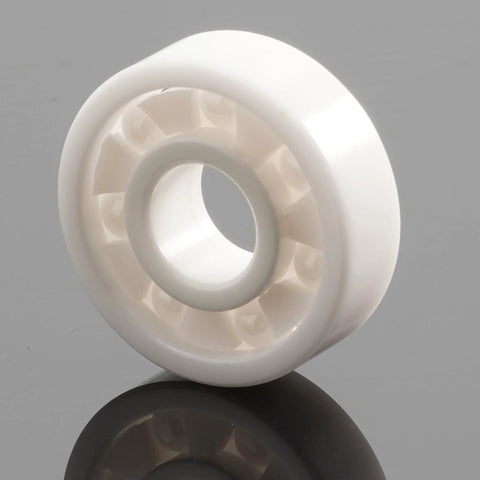 Front view of a white zirconia full-ceramic ball bearing (608 size).