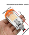 Hella Heavy Duty Water Oil Separator Filter For Air Compressor Built Different With Quarter Inch NPT Threads, mini clear filter in hand.