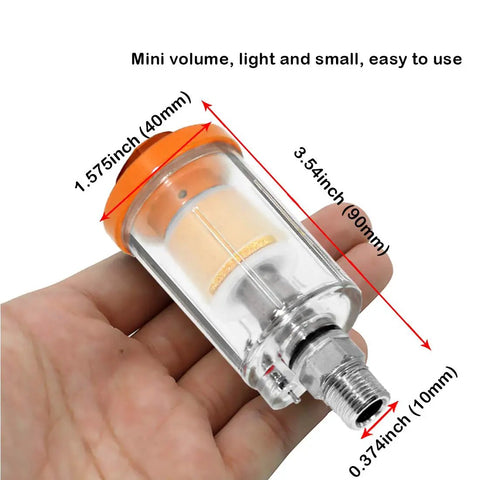 Hella Heavy Duty Water Oil Separator Filter For Air Compressor Built Different With Quarter Inch NPT Threads, mini clear filter in hand.