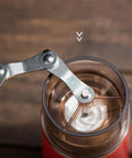 Kickstart Your Morning Anywhere With This Portable Manual Coffee Maker Equipped With Integrated Grinder And Bean Compartment showing the grinder mechanism.