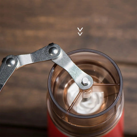 Kickstart Your Morning Anywhere With This Portable Manual Coffee Maker Equipped With Integrated Grinder And Bean Compartment showing the grinder mechanism.
