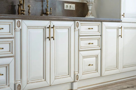 White kitchen cabinets with Six Pack 3 Inch Hole Center Cabinet Pulls Antique Brass Zinc Alloy Drawer Handles, enhancing furniture with vintage charm.