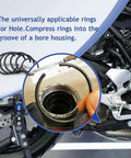 Hand holding snap ring from 180 Pcs Snap Ring Set For Holes 4 To 20 Mm In 65Mn Spring Steel Phosphated Surface Retaining Rings Kit For DIYers Round Wire Bearing Stop Rings For Axial Movement