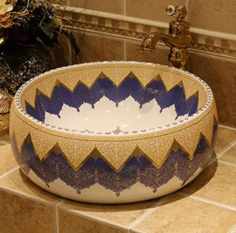 Knockout Round Ceramic Vessel Sink With A Dope Sprayed Enamel Finish Solid Pick For Countertop Setup Perfect Mediterranean Bathroom Washbasin Single Hole Ready Holds 12 Liters Daily, featuring intricate blue and gold patterns.