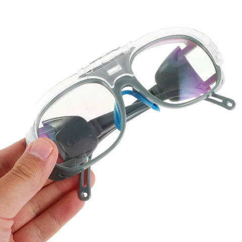 Badass Impact Resistant Welding Safety Goggles 3 Piece Set In Black Gray Shades For Arc Welding Dust Splash Defense held in hand