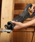 Close-up of Heavy Duty Corded Reciprocating Saw 120V With 6.0 Amp Motor And 2800 RPM, cutting metal pipe effortlessly.