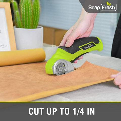 Cordless Electric Scissors 4V Mini Box Cutter With Replacement Blade And Charger For Cardboard, Carpet, Leather, Plastic, Quiet Low Noise Rotary Cutter For Packages And DIY Projects, Green being used to cut brown material