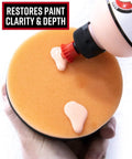 Close-up of orange compound pad with product from Scratch And Swirl Remover Hand Correction Kit For Cars, 4 oz bottle.