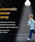 Hella Bright LED Motion And Light Sensor Lamp with child running under the light, showcasing flexible directional head, indoor use.