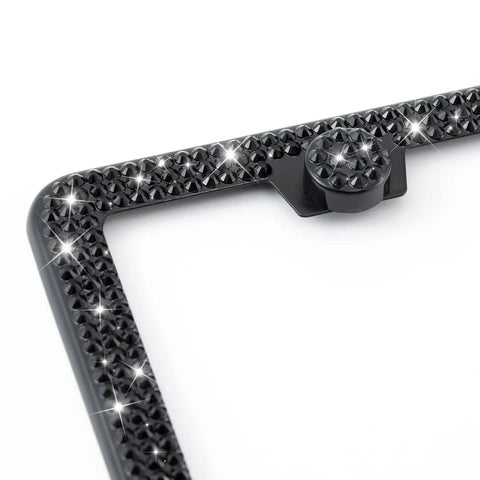 Corner view of sparkly black Two Pack Premium Stainless Steel Rhinestone License Plate Frame For Women Glitter Crystal Diamond Bling.