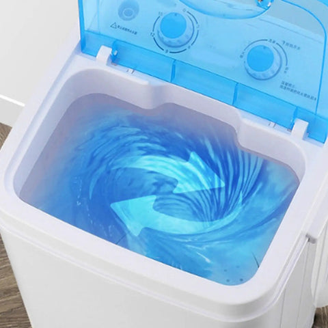 Compact Portable Washing Machine With 7.5 Liter Basin for Quick Laundry and Sneaker Scrubs showing water swirl in basin.