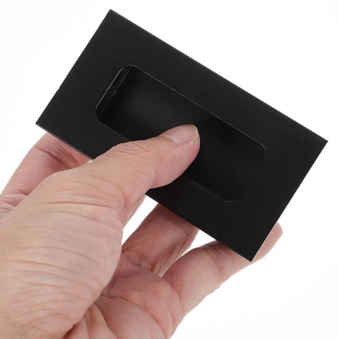 Person holding Black Aluminum Hidden Recessed Door Handles 2 Pack Concealed Cabinet Pulls For Furniture Doors And Drawers