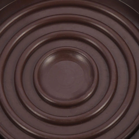 Close-up of Four Pack Brown Rubber Furniture Foot Pads For Chair And Table Legs Non Slip Round Protectors