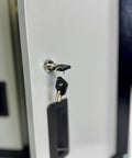Close-up of HMC tubular lock with keys on Heavy Duty Steel Security Cabinet With 2 Adjustable Shelves Pre Drilled Holes And Mounting Hardware HMC Tubular Lock With 100 Combinations 66 Pound Frame Load 22 Pound Per Shelf Compact 12 Inch Depth
