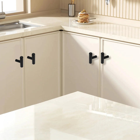 Six Pack 2 Inch T Bar Cabinet Knobs In Brushed Nickel Finish installed on white kitchen cabinets.